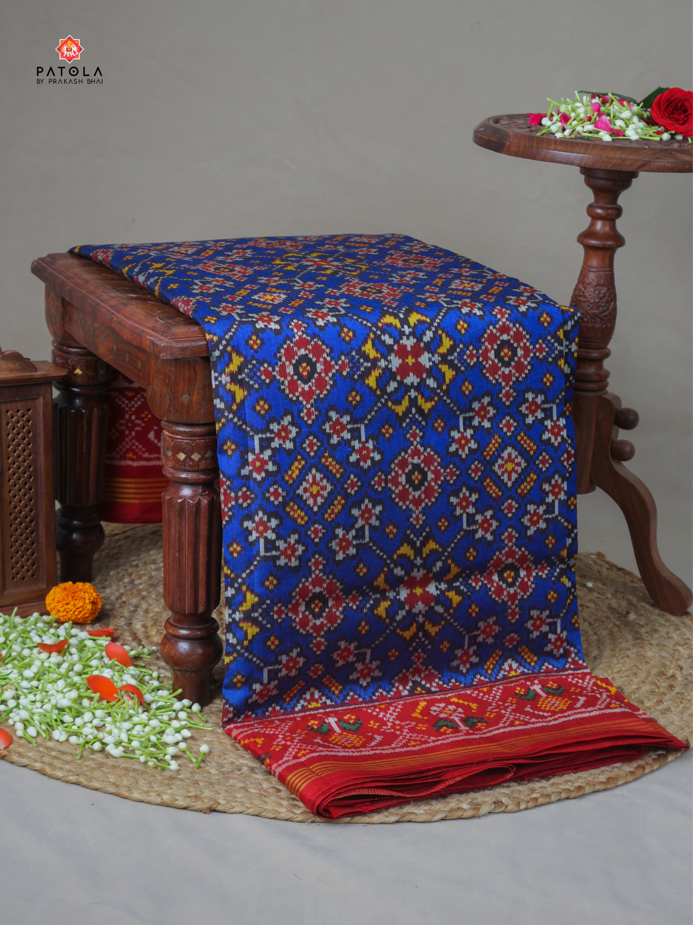 Navratna design with ghughro  border semi double ikat patola saree