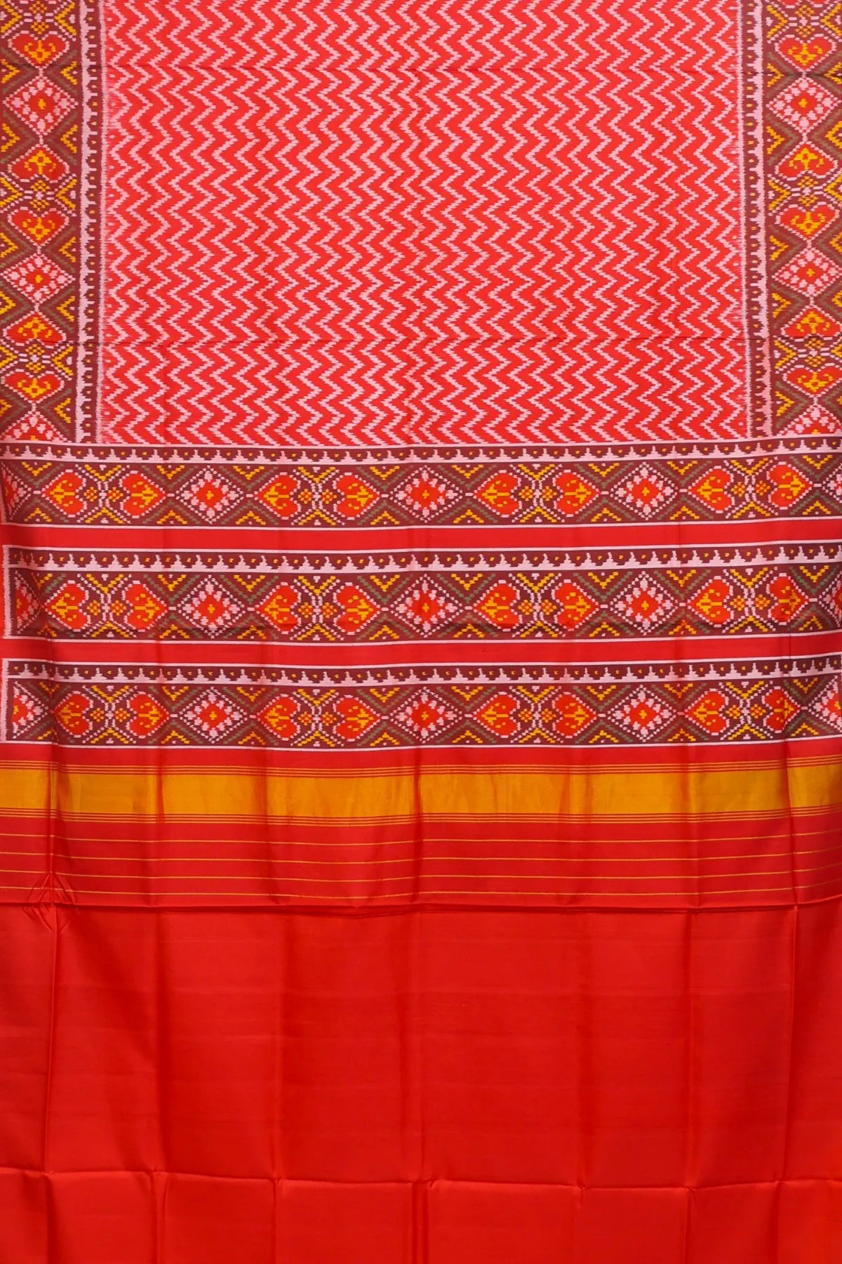 Zig-zag with pallu border flower design semi double ikat patola saree