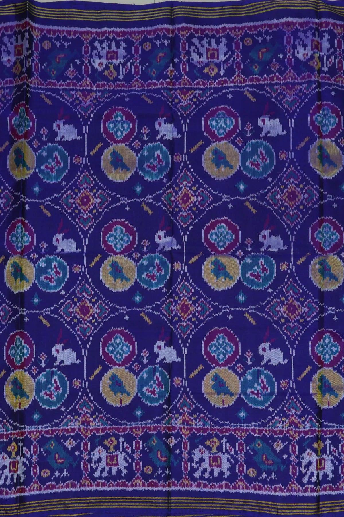 Chhabdi with motif design plain blue color semi double ikat patola saree