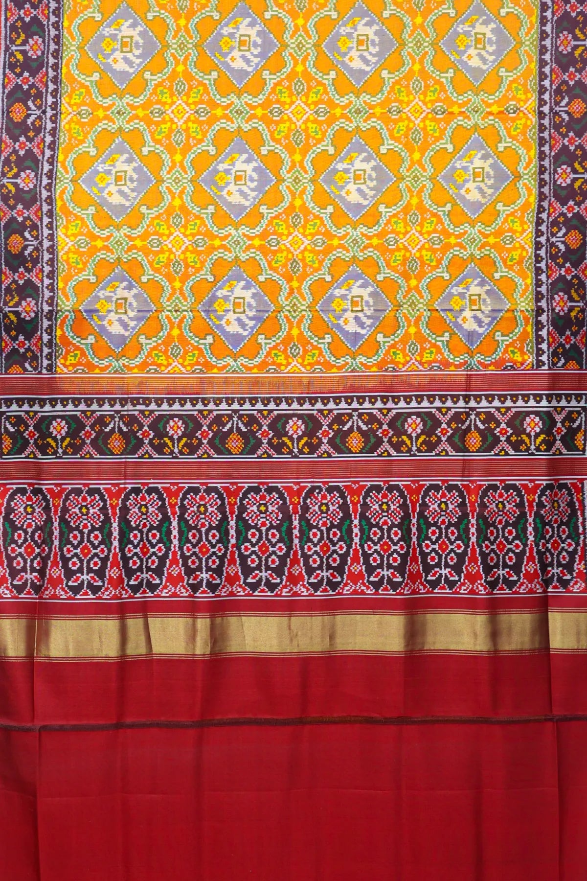 Rangoli design with elephant & pallu border ghughroo design semi double ikat patola saree