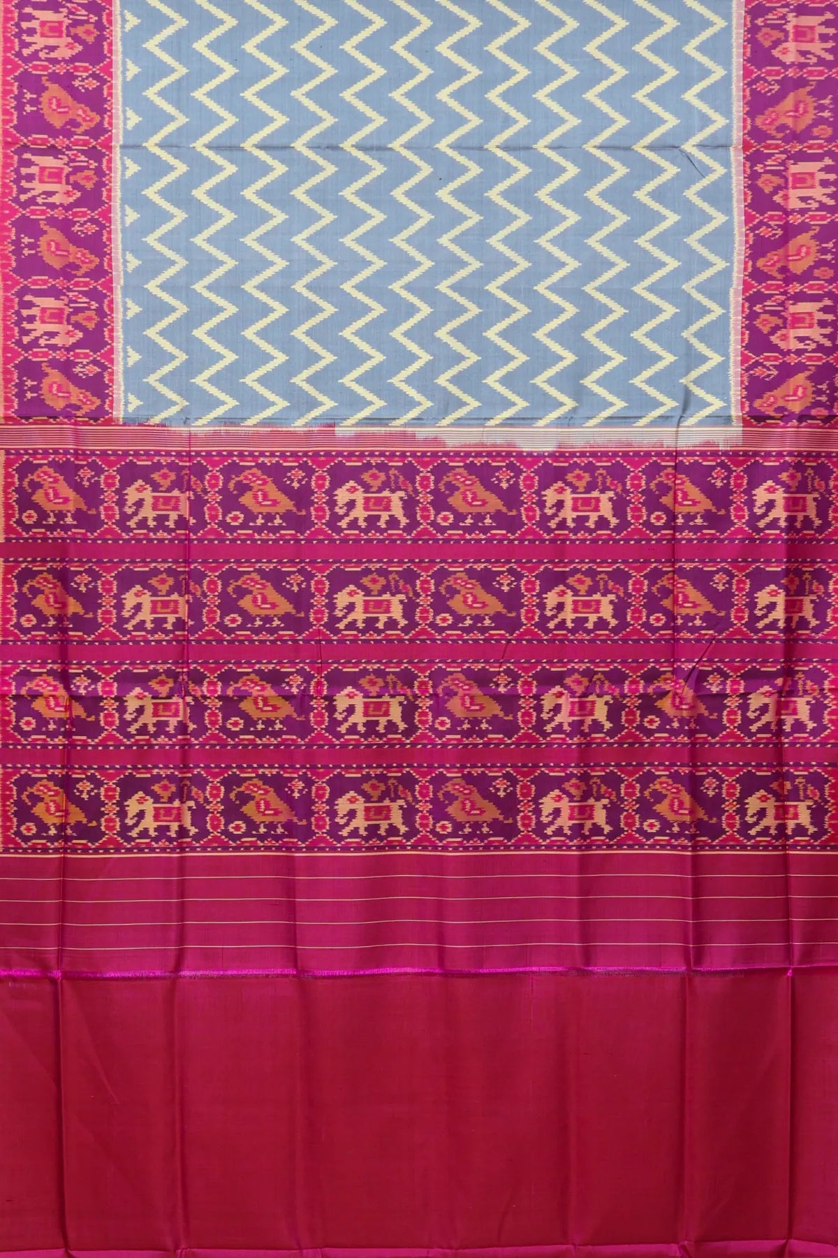 Zig-zag with traditional motifs design border single ikat patola saree