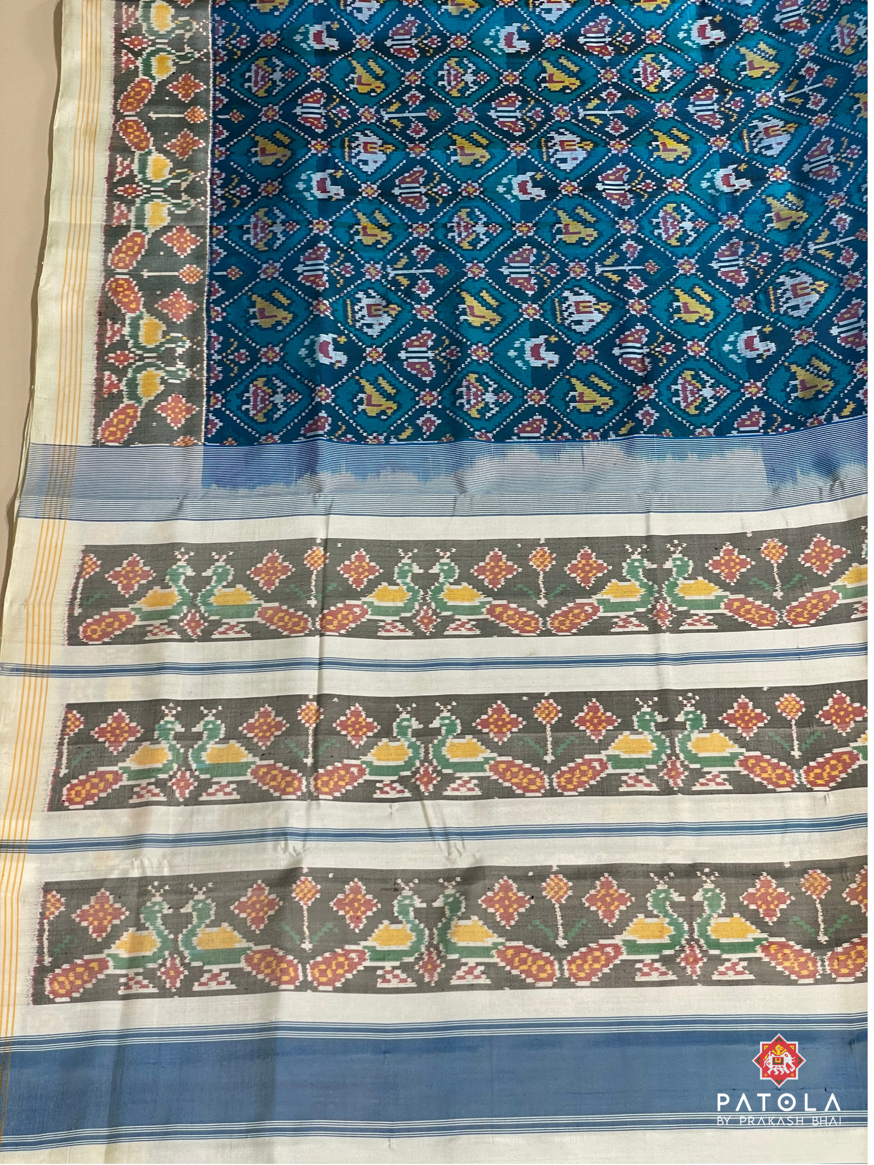 Traditional Small Narikunj Design With Pallu Border Contrast Semi Double Ikat Patola Saree