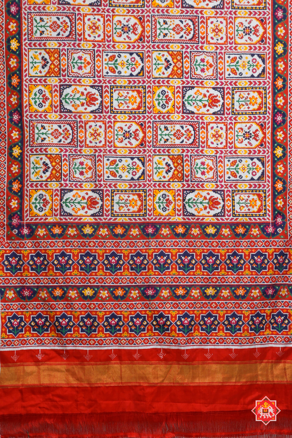 Signature piece patan patola silk double ikat jharokha design off white saree