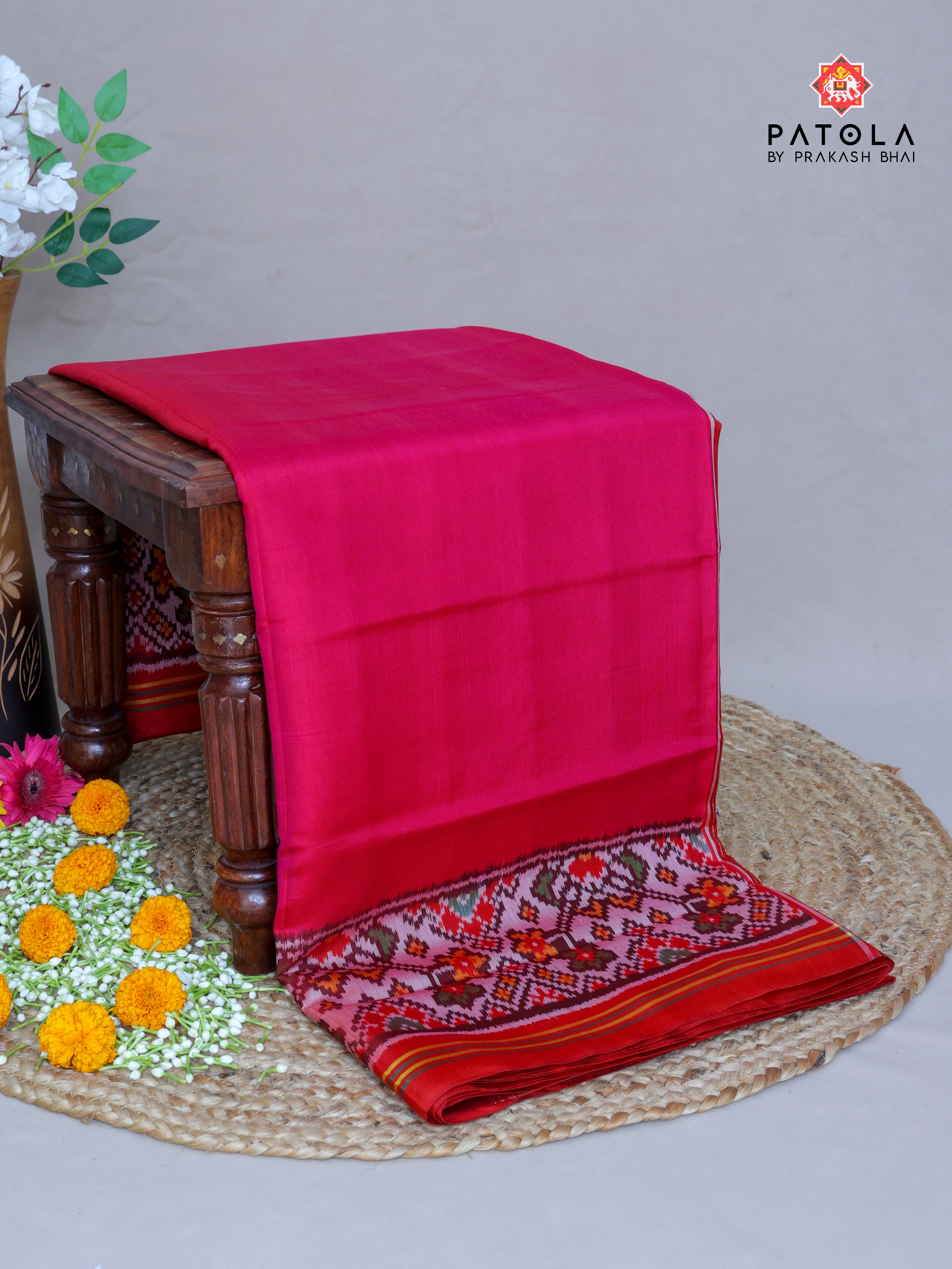 Plain Rani Pink With Navratna Design Border Semi Double Ikat Patola Saree