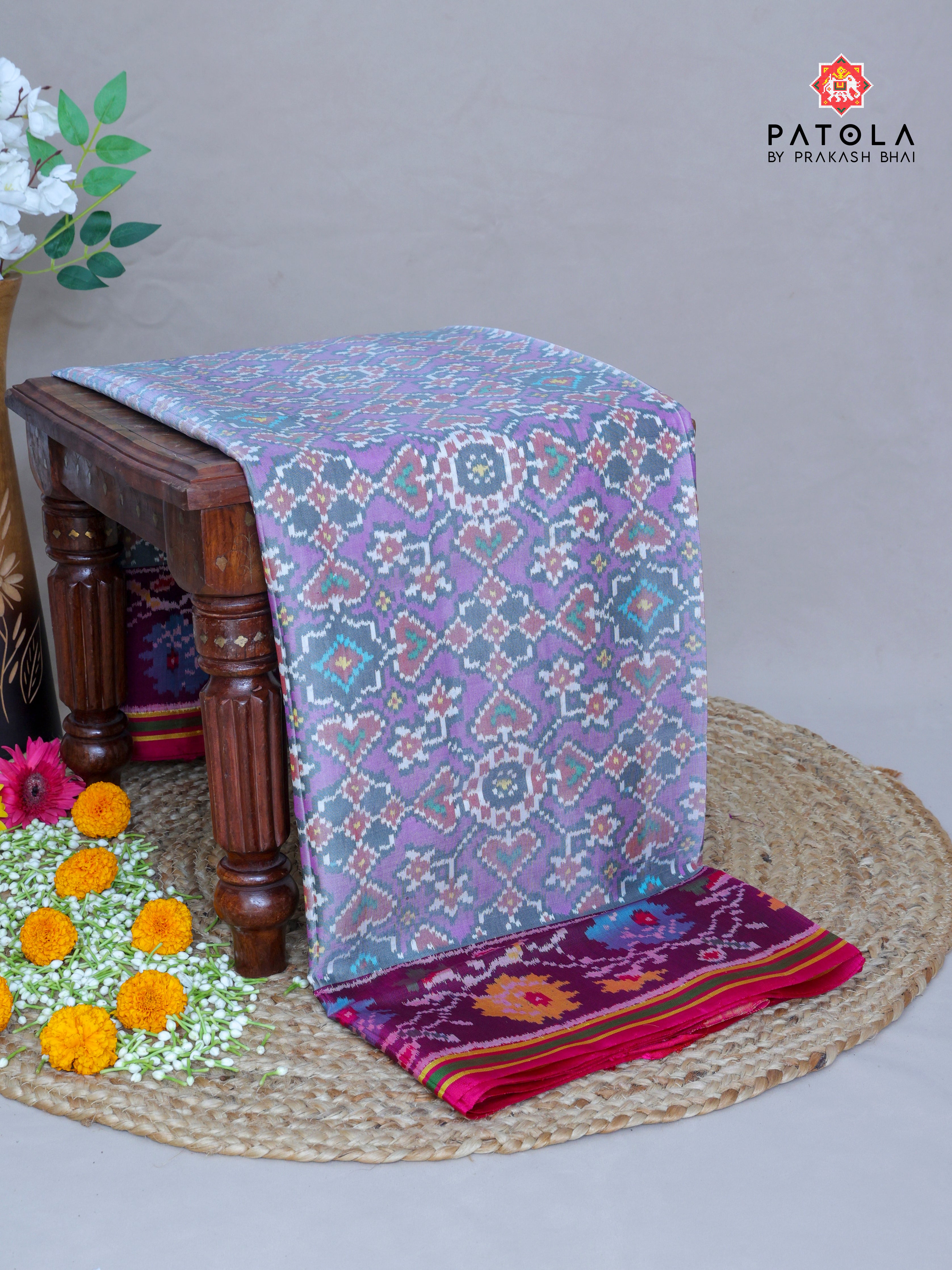 Navratna Pan Chanda Mix With Flower Border Semi Double Ikat Patola Sareee