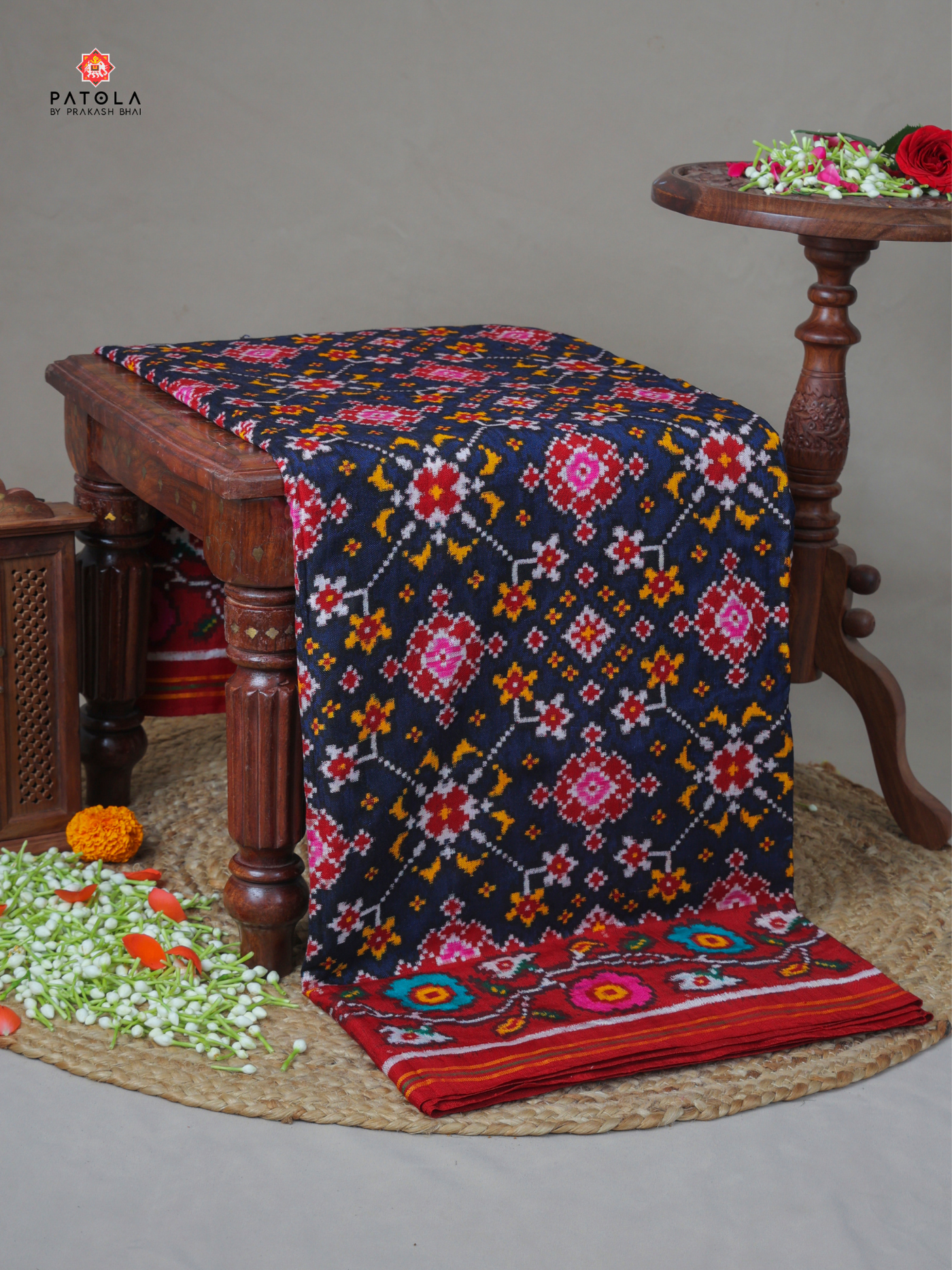 Nevy blue navratna design with flowers border pure double ikat patola saree