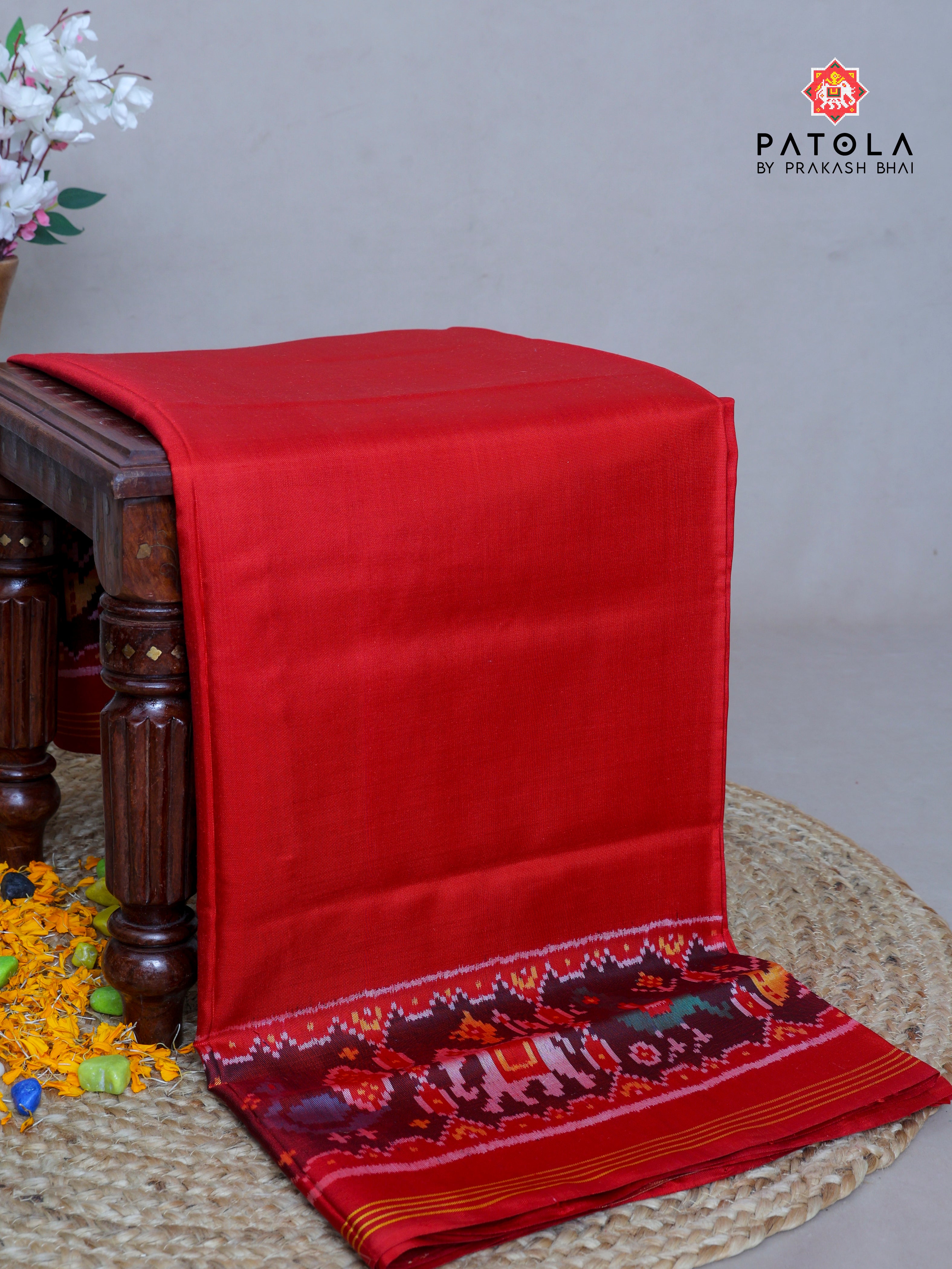 Neeta Ambani Signature Piece  Plain Red With Patola Design Blouse Semi Double Ikat Patola Saree