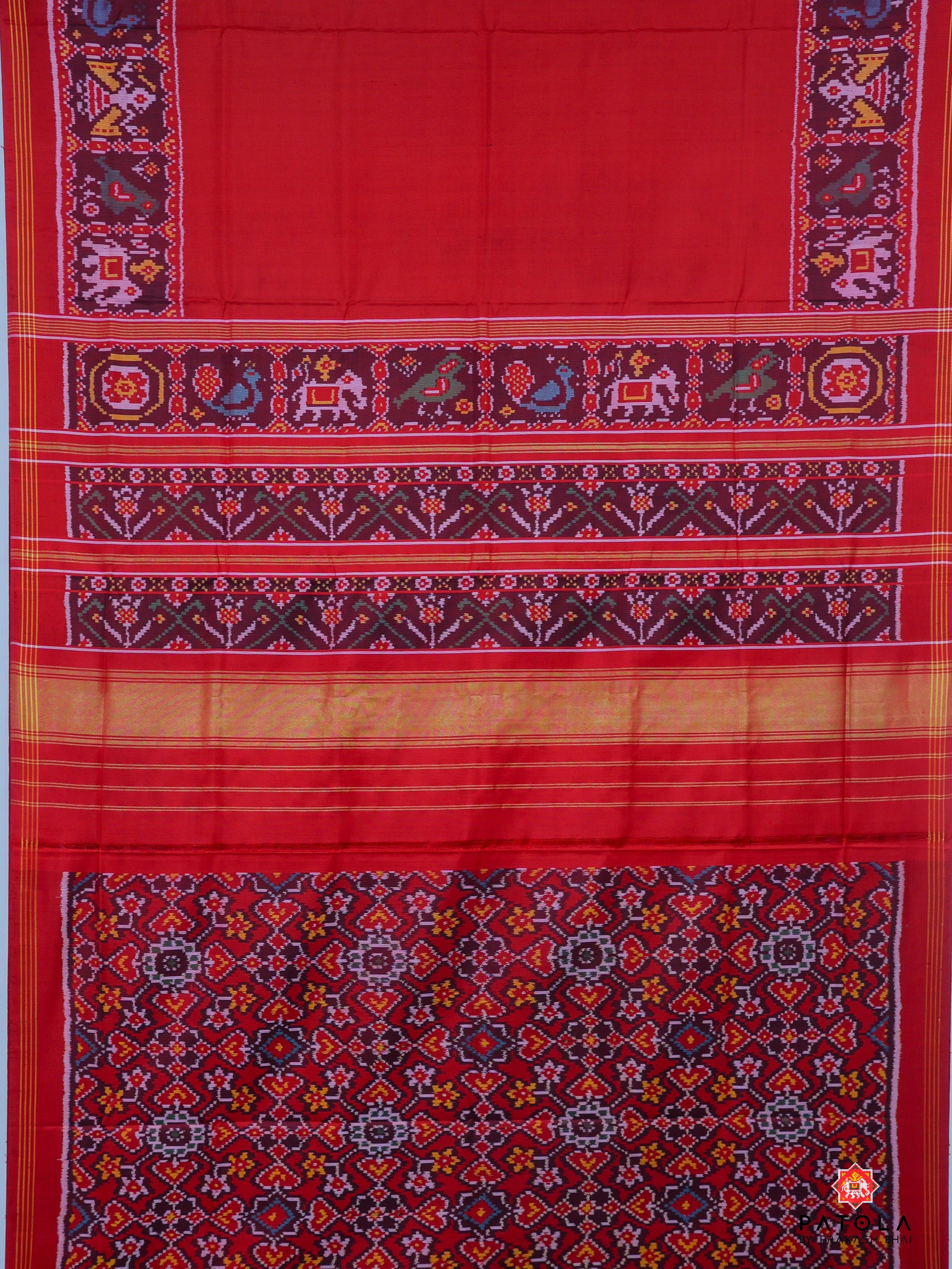 Neeta Ambani Signature Piece  Plain Red With Patola Design Blouse Semi Double Ikat Patola Saree