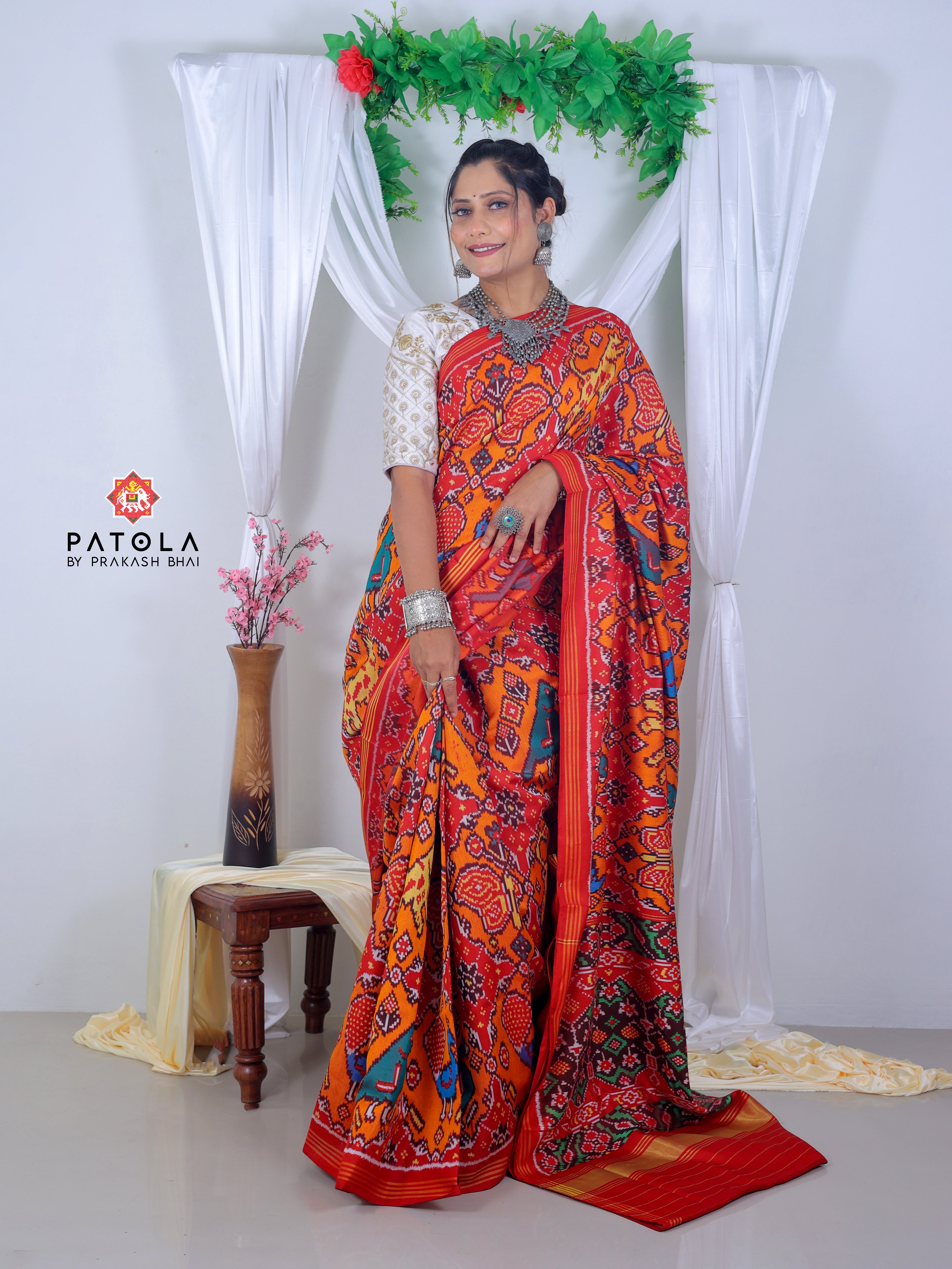 Orange Chhabdi With Figures Designer Twill Patola Saree